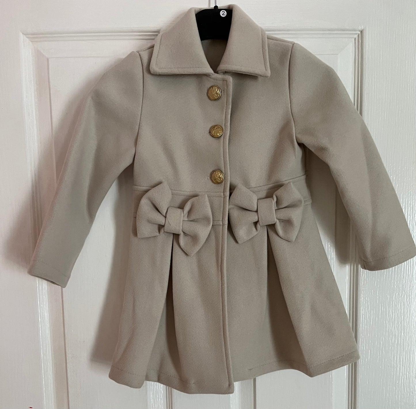 Spanish style bow coats