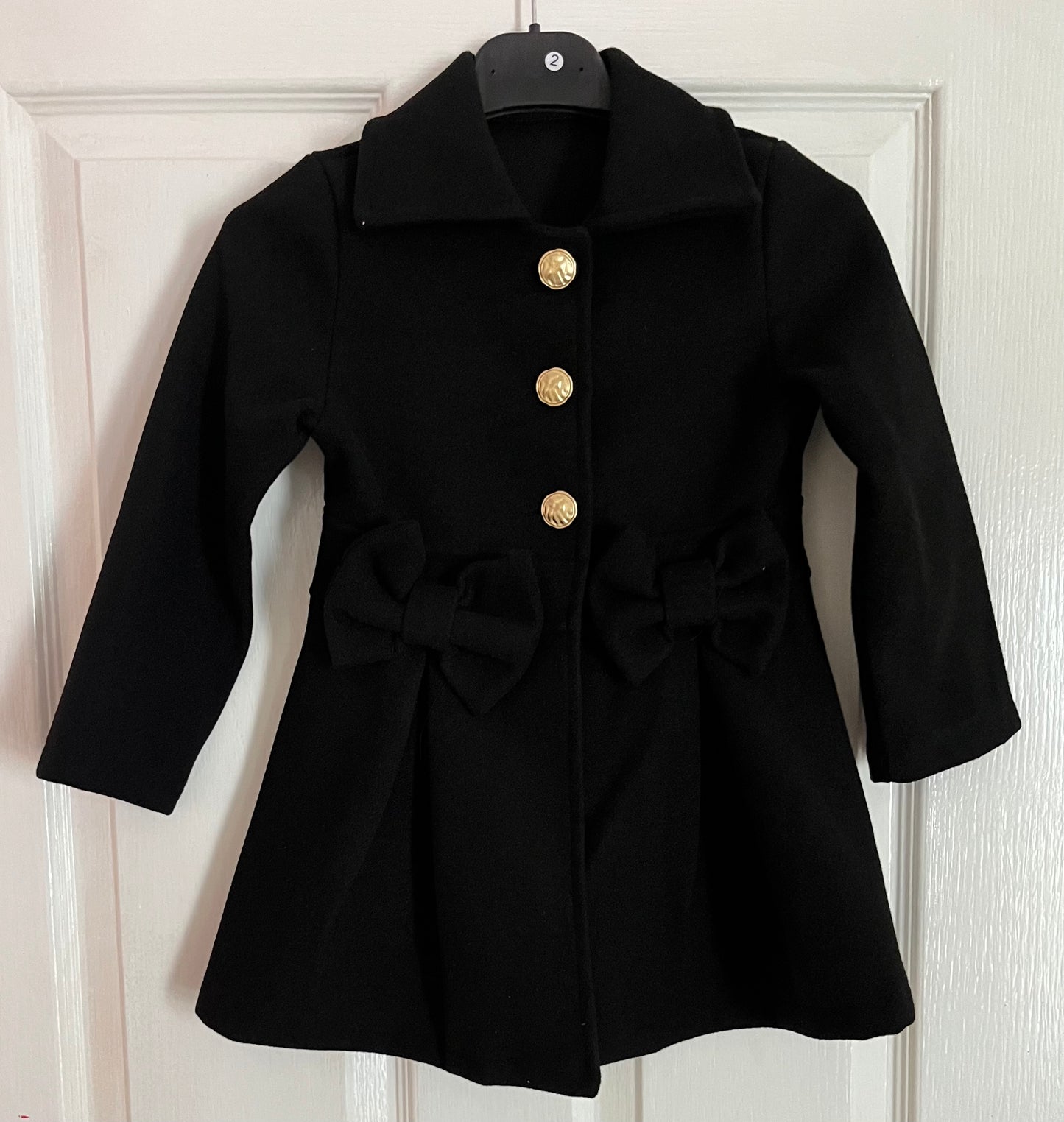 Spanish style bow coats