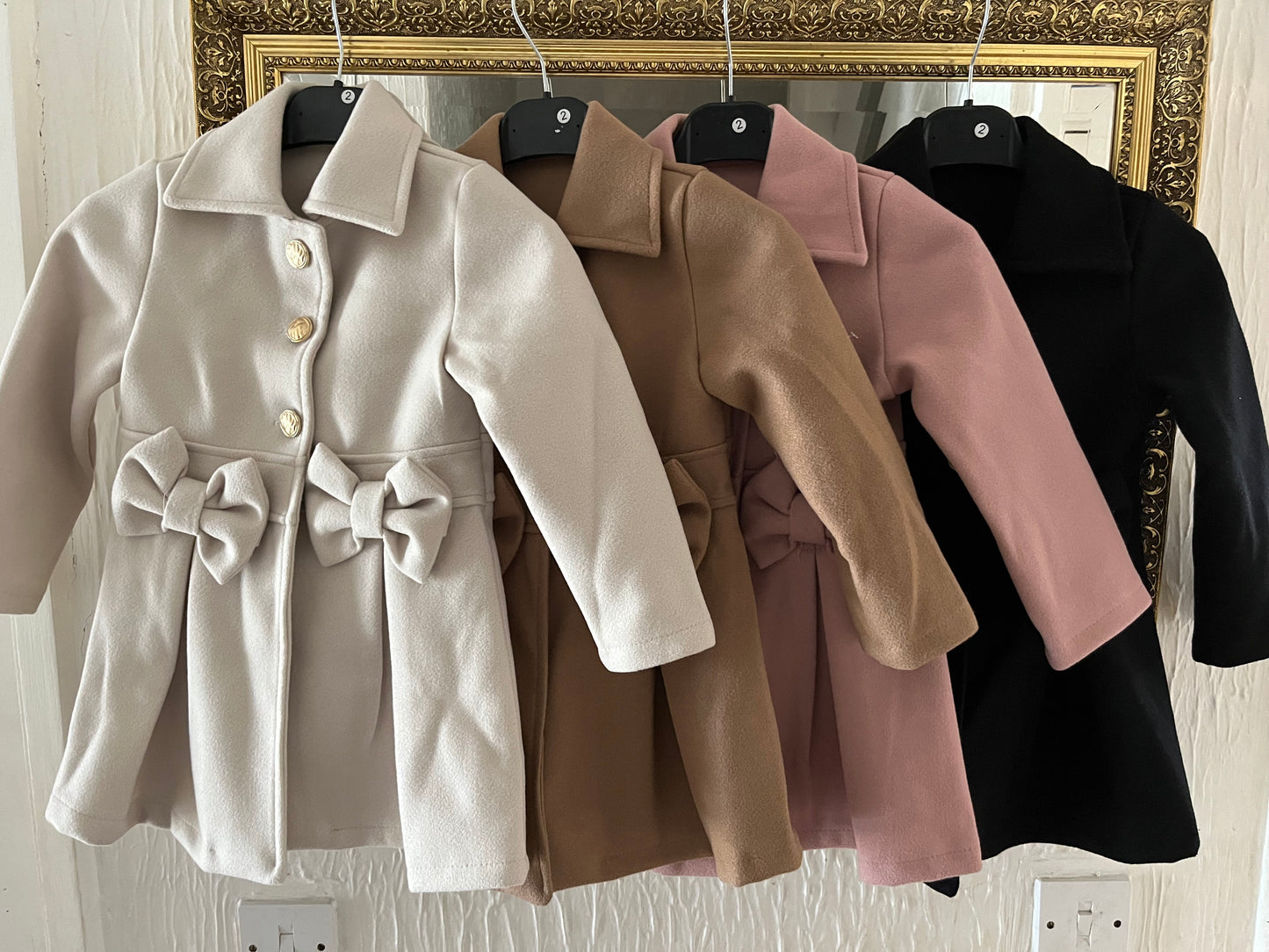 Spanish style bow coats