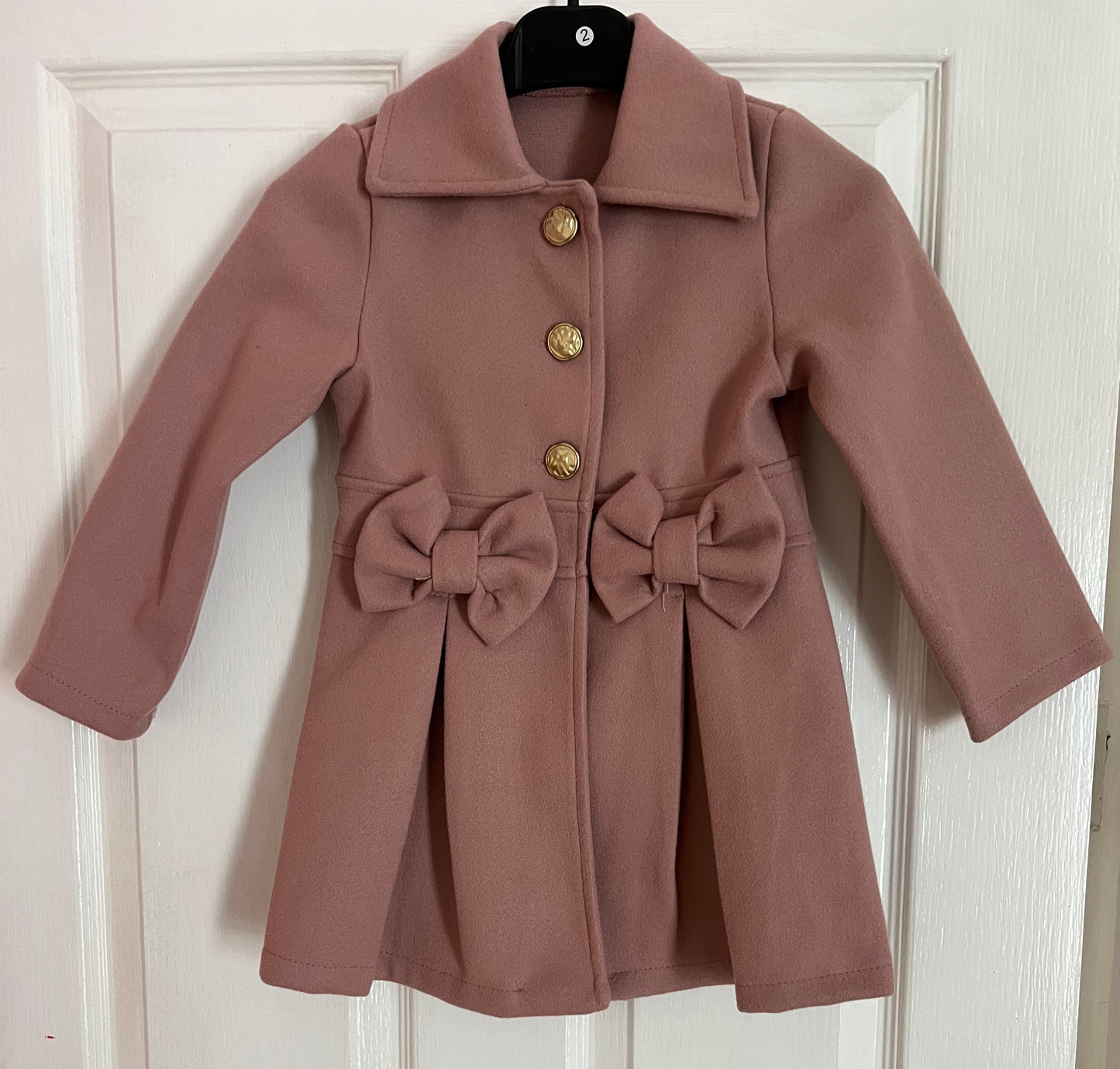 Spanish style bow coats
